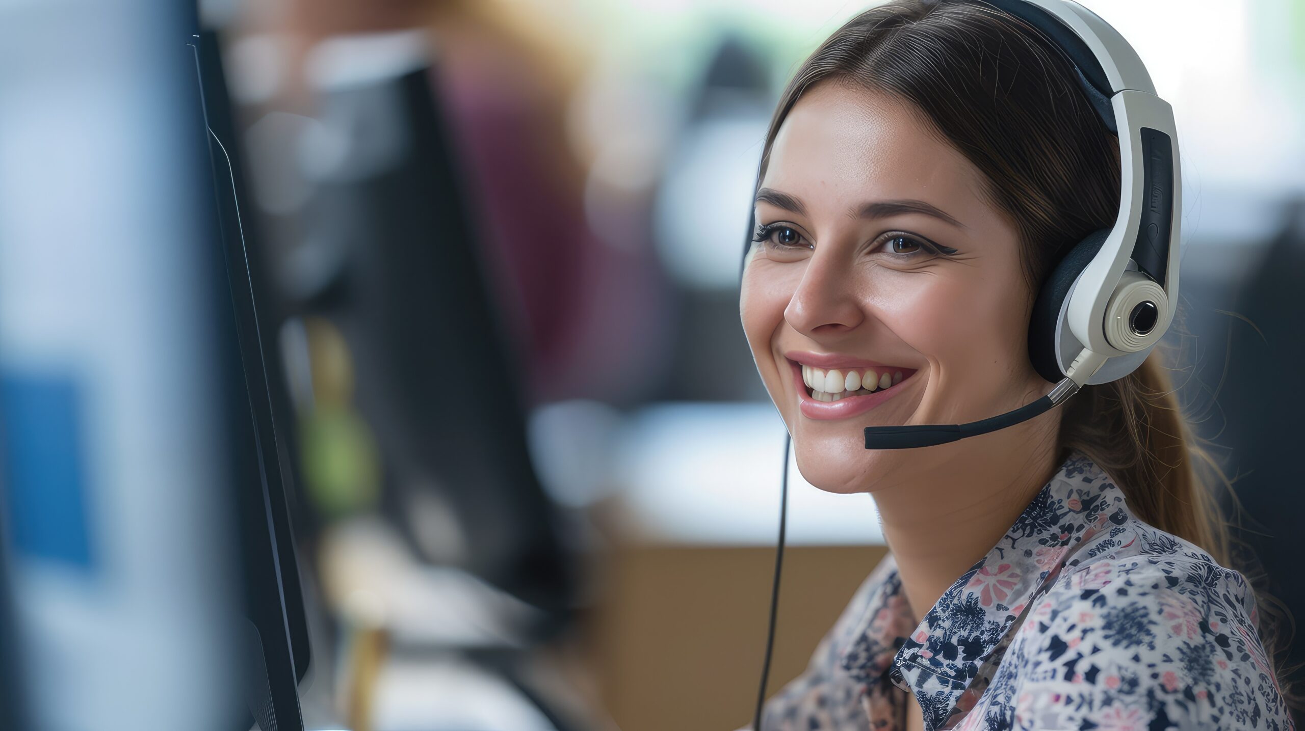 Indian business owner answering UK customer calls using a UK phone number and call forwarding service.