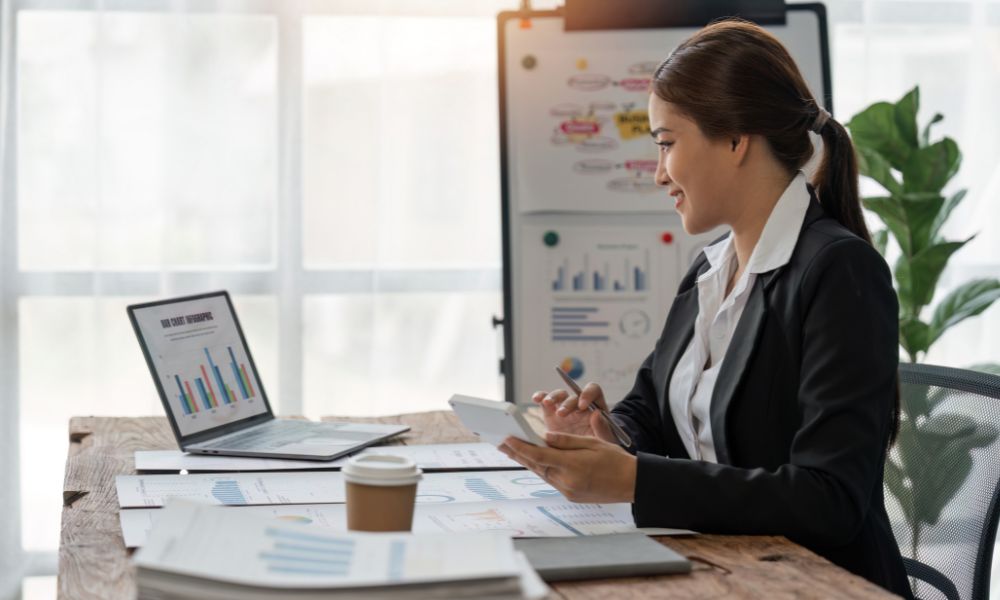 Small business owner is busy doing her taxes.