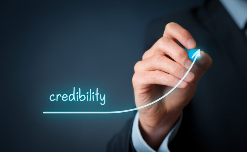 Business professional illustrating the growth of business credibility with an upward trend line, representing trust, reputation, professionalism, and long-term business success.