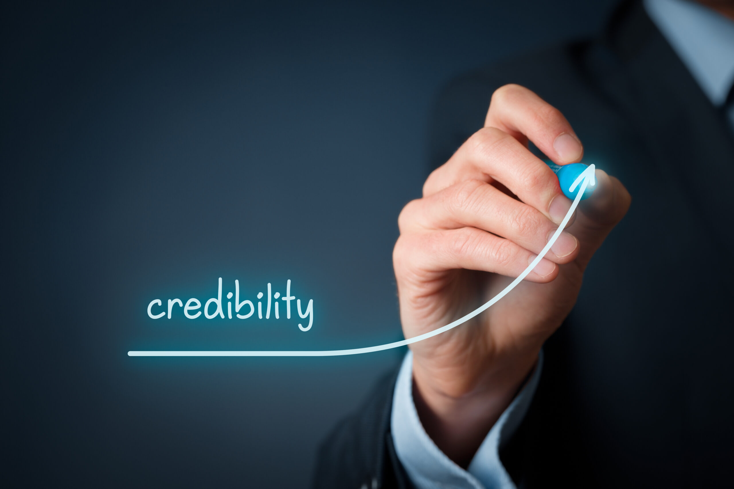 Business professional illustrating the growth of business credibility with an upward trend line, representing trust, reputation, professionalism, and long-term business success.