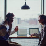 Business professionals discussing growth opportunities and customer engagement in a modern workspace environment.